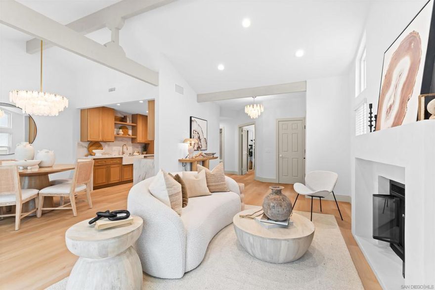 Situated on a peaceful cul-de-sac within the desirable Seagate Village community, this beautifully updated single-level residence offers a refined coastal lifestyle with thoughtful design and everyday comfort in mind. Reimagined by the acclaimed Clay-haus design studio, the home showcases three bedrooms and two bathrooms with elevated finishes throughout. The interior features wide-plank flooring, custom cabinetry, high-end fixtures, and a striking Venetian plaster fireplace that anchors the living space. An open, light-filled floor plan creates an effortless flow between living, dining, and kitchen areas, making the home equally suited for relaxed living and hosting. The kitchen is both functional and visually striking, featuring quartz countertops, sleek cabinetry, and new premium appliances. The primary suite provides a private retreat with a custom built-in closet and a beautifully renovated en suite bathroom. Two additional bedrooms offer flexibility for guests or a home office, while both bathrooms are finished with refined tile work and contemporary detailing. Outdoors, the landscaped backyard offers a serene setting for outdoor dining, lounging, or enjoying coastal evenings in privacy. Residents of Seagate Village enjoy access to community pools, a spa, playground, tennis and pickleball courts, bocce courts, walking trails, and picnic areas. Conveniently located just minutes from beaches, shopping, dining, and top-rated schools, this home combines thoughtful design with an exceptional location.