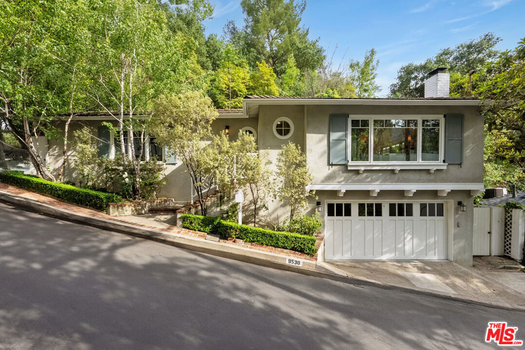 Just minutes from Downtown Beverly Hills, this charming home is tucked away on a private cul-de-sac off Coldwater Canyon. Inside, two private bedrooms each offer en-suite marble baths, including a spacious primary suite with a walk-in closet and its own secluded patio with hot tub. The open living and dining area features a gas fireplace and French doors that lead to a sunny deckideal for indoor-outdoor living. A well-appointed kitchen boasts stainless steel appliances, marble countertops, and a stackable washer and dryer. With crown moldings, hardwood floors, and Waterworks fixtures throughout, this elegant residence embodies classic Beverly Hills living. Furnished rate available upon request.