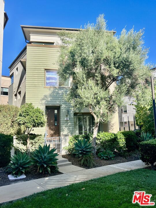 Stunning 4 bed, 4 bath, 2,304 sq ft single-family home in the heart of Playa Vista! This rare lease opportunity combines modern luxury, thoughtful upgrades, and access to Playa Vista's premier amenities, including The Resort and The CenterPointe Club with fitness centers, pools, spas, business spaces, classes, and community activities. Interior highlights include French oak hardwood floors throughout, an updated kitchen with high-end appliances, pantry, breakfast nook, and a spacious living room with gas fireplace and balcony. The main suite features its own balcony, a large walk-in closet, and a spa-like ensuite bath. The laundry room is conveniently located on the second floor. The lower-level bedroom includes an ensuite bathroom, fridge, microwave, and sink, plus sliding doors opening to a private wrap-around patio facing a tranquil greenbelt walking path. Outdoor living is exceptional with a resort-style patio featuring built-in barbecue with spice rack, comfortable seating area, outdoor heater, and stylish patio lights perfect for year-round entertaining. Additional features include two balconies, central heating and air with thermostats on each floor, solar panels, and an Aquasana water filtration system. The home also has a two-car garage with storage, bike hangers, EV charging outlet, and an additional private parking space beside the home for guests. Enjoy the full Playa Vista lifestyle walk to parks, trails, shops, restaurants, Whole Foods, and the community's vibrant event schedule.