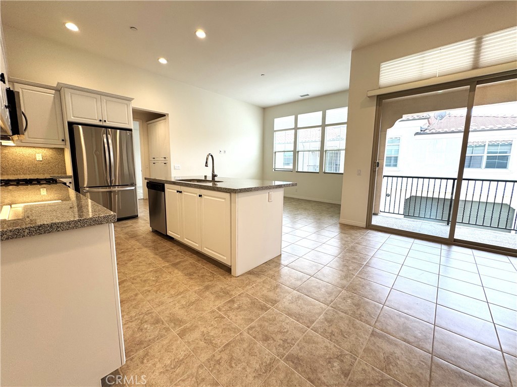 This lovely condo is located in Irvine's Eastwood Village. Just a few doors down from Eastwood Elementary School, this property is also directly across the street from the community's Eucalyptus Park and pool area. It is a rear unit with an open floor plan, 3 bedrooms and 2 bathrooms all on the second level. An outer main door provides added security. The primary bedroom has a walk-in closet and there is additional storage in the hallway. Refrigerator and washer/dryer are included, and there is a plug for electric vehicles.