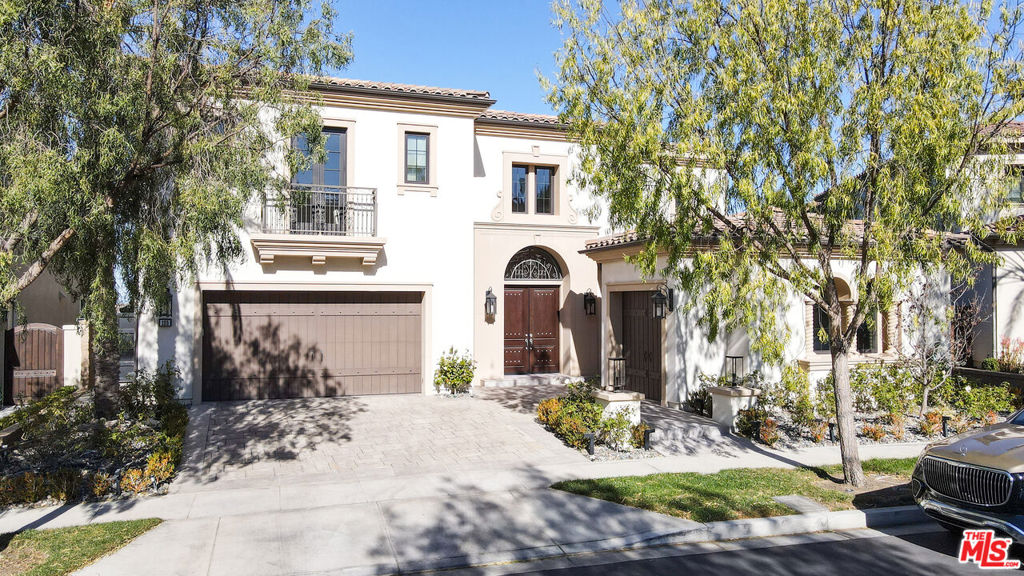 Experience unparalleled luxury and sophistication in this stunning 5-bedroom, 5.5-bathroom residence located in the exclusive, 24/7 guarded-gated Hidden Canyon community in Irvine. Nestled on a sprawling 10,578+ sq. ft. lot with breathtaking city lights and mountain views, this 5,453 sq. ft. estate boasts a dual grand staircase entry, a designer kitchen with Wolf appliances, an oversized island, and glass pocket doors seamlessly blending indoor and outdoor living. The expansive backyard is an entertainer's dream, featuring a pool, spa, built-in BBQ, and a golf putting green. Upstairs, the luxurious master suite offers a private retreat with panoramic views, a spa-like bathroom, and a walk-in closet. Hidden Canyon residents enjoy resort-style amenities, including a clubhouse, pool, spa, and playground, with award-winning Irvine schools, world-class shopping, dining, and beaches just moments away. Stay tuned for a showcase of captivating photos to truly appreciate this remarkable home!