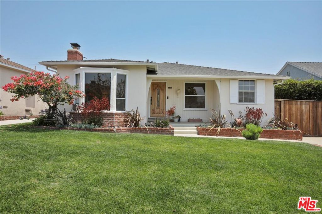 Located in the most desirable neighborhood in Westchester, this Kentwood charmer has it all. With three bedrooms, two bathrooms and a detached converted garage, there is plenty of room for family, guests, and a home office. This unique home's interior features crisp, white walls with new hardwood floors and a central HVAC system. The large living room offers a bay window, brick fireplace, and beautiful hardwood floors that continue into the dining room, as well as down the long hallway to the bedrooms. Each bedroom is bright, comfortable, and has direct access to the lush backyard, creating the ultimate indoor-outdoor feel. This beautiful property features a Jacuzzi tub with massage jets in one of the bathrooms, perfect for a relaxing soak. The updated kitchen is laid out to maximize counter space and storage, while still providing a peninsula that is perfect to gather around and serve from. The backyard is also accessible from the kitchen, where one can set up a BBQ or dine under the trellis of blooming wisteria. The professionally landscaped backyard is complete with a large grassy area, beautiful plants, and decorative rocks, offering additional room to dine, play, and relax. The converted garage space has tile flooring, Mitsubishi Electric heat pump for cooling and heat, and panoramic doors which fold away for seamless indoor-outdoor living. Additional amenities include an ADT alarm system with 24/7 video camera surveillance and monitoring as well as Spectrum internet. You'll love this neighborhood, which is complete with sidewalks and annual events to enjoy! Irrigation water, and gardener are included. Sorry, no pets!