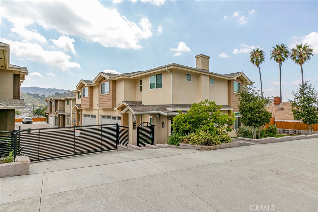 Don’t miss this rare find in a secure gated community—priced to move! This thoughtfully designed 8-unit complex combines privacy and quality. Inside, you’ll enjoy soaring ceilings, quartz countertops, and inviting private patios. The bright open floor plan features a cozy fireplace with color-changing settings, a dining area with sliding doors to the outdoors, and a sleek kitchen with stainless-steel appliances, and breakfast nook. Upstairs offers four bedrooms with generous storage, creating the perfect balance of comfort and flexibility. Intercom access, 2 attached parking with a BBQ/picnic area, and a cobblestone paver driveway—all just minutes from shopping and freeways—this home delivers convenience, security, and modern living in one perfect package.