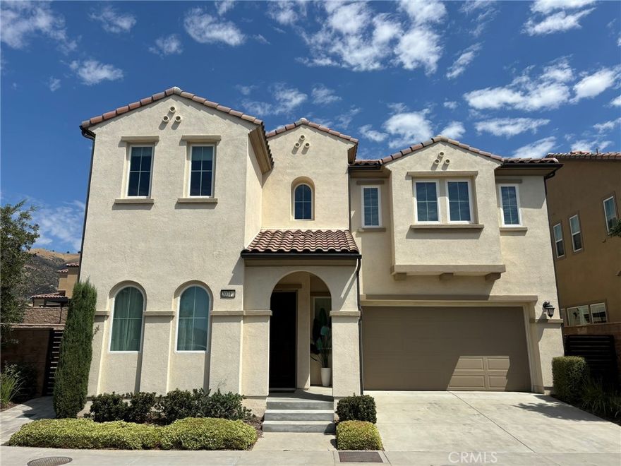 Welcome to this breathtaking newer construction home located at The Canyons, a 24/7 Guard Gated Community in Porter Ranch! This exceptional residence perfectly combines luxury and comfort! The main floor includes a versatile bedroom currently set up as an office, complete with built-in cabinetry and an adjacent bathroom. The open floor plan seamlessly connects the living, dining, and kitchen areas, making it an ideal space for entertaining. The gourmet kitchen features a large center island, high-end stainless steel appliances, and a walk-in pantry. Upstairs, you'll find the secondary bedrooms are generously sized! The upstairs laundry room is equipped with a sink, cabinets, and Whirlpool front loaders. At the end of the hallway, retreat to the luxurious primary suite, which boasts a spa-like bath with dual sinks, a soaking tub, a separate shower, and a custom closet accessible from the bathroom. Don’t miss this chance to lease this extraordinary home and experience the comfort, elegance, and exceptional amenities of The Canyons at Porter Ranch!