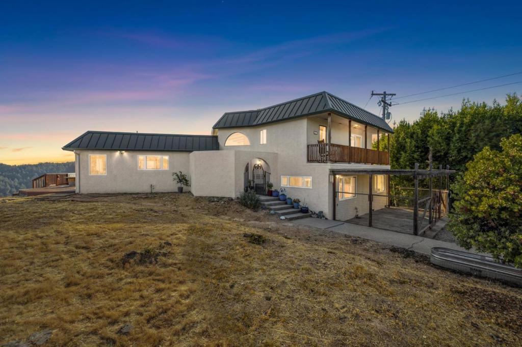 Perched atop the highly desirable Saratoga Hills, this stunning 4 bedroom, 2 bathroom home offers the perfect blend of privacy, natural beauty, and everyday convenience. Situated on 2.27 peaceful acres, the property boasts sweeping views of Monterey Bay, and on clear days, even offers glimpses of the iconic Golden Gate Bridge. Inside, the home features beautiful arched windows that frame the breathtaking surroundings and fill the space with natural light. Thoughtfully designed across three levels, the layout provides both comfort and flexibility. Despite its tranquil mountain setting, the home is easily accessible via paved, well-maintained roads and is just 15 minutes from the heart of downtown Saratoga. A rare opportunity to own a one-of-a-kind retreat with iconic views, architectural charm, and serene seclusion.