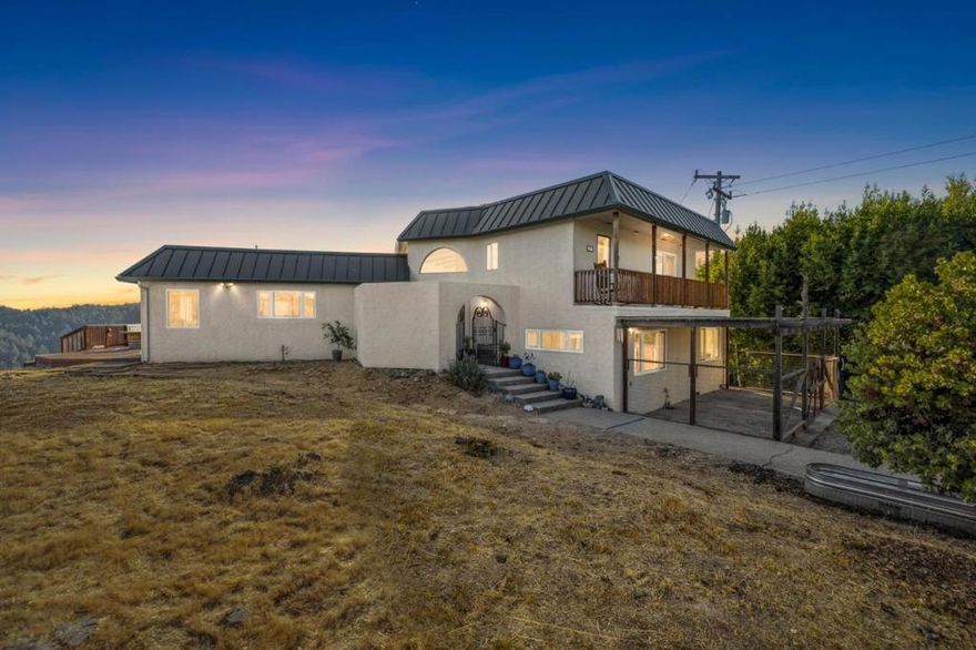 Perched atop the highly desirable Saratoga Hills, this stunning 4-bedroom, 2-bathroom home offers the perfect blend of privacy, natural beauty, and modern convenience. Situated on 2.27 peaceful acres, the property boasts sweeping views of Monterey Bay - and on clear days, even glimpses of the iconic Golden Gate Bridge. Inside, the home features beautiful arched windows that frame the breathtaking surroundings and fill the space with natural light. Thoughtfully designed across three levels, the layout provides both comfort and flexibility.  This home is located within the sought-after Saratoga High School District, offering exceptional educational opportunities. Upgrades include a Full House Ozone water filtration system for pristine water quality, two Tesla battery backup power systems paired with a generator for reliable energy security, and high-speed AT&T fiber optic internet with Starlink backup, ensuring uninterrupted connectivity for work and play.  Despite its tranquil mountain setting, the home is easily accessible via paved, well-maintained roads and is just 15 minutes from the heart of downtown Saratoga. A rare opportunity to own a retreat with iconic views, architectural charm, and serene seclusion - plus the modern amenities that elevate everyday living.
