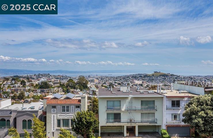 There are multiple huge views seen from various angles within the inviting floor plan. The home has an entry foyer, two nice size bedrooms, a kitchen, a large living room /dining room space and an ample bathroom. There is also a large, exclusive use, very private patio space, great for barbecuing, entertaining, and soaking in the views. There is an in-unit laundry, tons of storage space, and a warm stylistic sensibility throughout. Lots of windows create a fine, light-filled space. It's easy to see by appointment or during the scheduled showing times. Street parking only, this unit has No Garage.