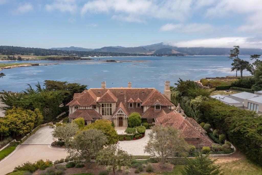Presenting one of the most valuable street-to-sea parcels on the West Coast a trophy asset in every sense, and an extraordinary opportunity to possess one of the most iconic properties in all of Pebble Beach. "Gem Cove" is located on two lots of record on an ocean front parcel of land next to the Lodge, with unobstructed ocean views to the 18th fairway, Stillwater Cove, Carmel Beach, Point Lobos and beyond. Truly a once-in-a-lifetime opening to secure your position in one of the most sought-after areas in the world. Built on a prime 2.24 ± acre parcel of coveted CA real estate, is this unforgettable European-esque estate is guaranteed to astound, impress and amaze the most astute buyer. From the substantial living room to the chef's kitchen/great room, the expansive primary bedroom suite to the expertly curated grounds, all with big ocean views - you will love living here, entertaining family and hosting guests at this prestigious estate. Located within minutes of world-class golf, Michelin-level dining, and elite networks, this property offers not just lifestyle, but legacy. Whether as a long-term family estate, strategic investment, or a rare coastal retreat, "Gem Cove" presents the kind of opportunity that seldom comes. Don't miss it.