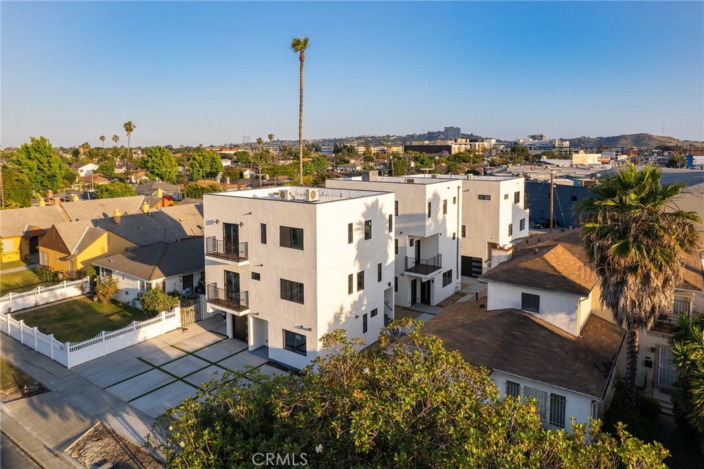 HIGHLIGHTS: PROPERTY IS NOT SUBJECT TO RENT CONTROL / Strong yield with a current in-place CAP Rate of 5.31% & a ProForma CAP Rate of 5.51% / Comparable sales within 0.5 radius are trading at an average of mid 5 CAP rate range, with 86% of those sales delivered vacant / Rental Demand & Growth – Located in a high-demand rental corridor with +6% to +24% rent growth potential based on comparable properties & unit size / 6082 W 18th (Front) Townhome-Style Unit – 3 Bed / 2 Bath, 1,246 sq. ft. (1st & 2nd levels) & Flat – 2 Bed / 1 Bath, 960 sq. ft. (3rd level) / 6084 W 18th (Middle) Flat – 1 Bed / 1 Bath, 564 sq. ft. (ground level) & Townhome-Style Unit – 4 Bed / 2.5 Bath, 1,366 sq. ft. (2nd & 3rd levels) / 6086 W 18th (Rear) Townhome-Style Unit – 3 Bed / 2 Bath, 1,089 sq. ft. (1st & 2nd levels) & Flat – 2 Bed / 2 Bath, 1,001 sq. ft. (3rd level)
6082–6086 W 18th St. Los Angeles, a stunning collection of three newly constructed (2023) modern buildings totaling six (6) high quality rental units. The property totals 6,226 square feet on a 0.15 acre lot. Each residence has been thoughtfully designed with open layouts, premium finishes, excellent
lighting, and generous floor plans, ideal for today’s urban lifestyle.
3 Townhome-Style Units – Spacious two-level residences averaging 1,234 sq. ft., ideal for families and professionals seeking larger layouts.
3 Flats – Efficient single-level residences averaging 842 sq. ft., well-suited for students, singles, and couples.