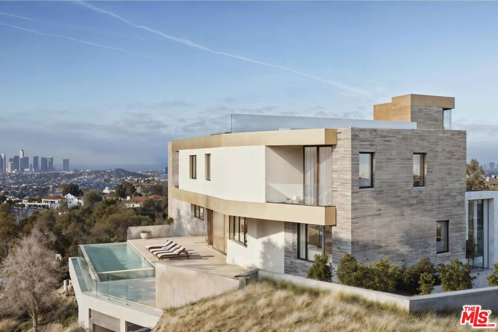 BEST READY-TO-ISSUE (RTI) DEVELOPMENT OPPORTUNITY IN BRENTWOOD! DTLA, CENTURY CITY & OCEAN VIEWS! START BUILDING IMMEDIATELY AFTER CLOSING! Welcome to "The Brentwood Observatory", an exceptional development opportunity of a roughly 8500 sq ft organic modern masterpiece on a extremely privatized promontory lot on Brentwoods most desirable street with unobstructed jetliner views of DTLA, Century City, the Getty, the ocean, and mountains. Conveniently skip years of navigating the bureaucracies and complexity of LADBS and design review boards and move forward with the development of this epic estate that will be delivered with ready-to-issue (RTI) plans for the Buyer. With no surrounding neighbors to the property other than across the street given that the property is adjacent to city owned reservation land, this property contains unparalleled privacy. With several comps on Tigertail selling around $2000-$3000 price per square foot, this development opportunity has a potential valuation of NEARLY $20,000,000 once completed! Within close proximity to all the best restaurants, shopping, hiking trails, and schools that Brentwood has to offer. Truly a jaw dropping development opportunity that will be delivered Ready to Issue with millions in potential upside. For owner users or investors, the listing agent(s) development company Thornton Development Group can develop the home, consult for pricing.