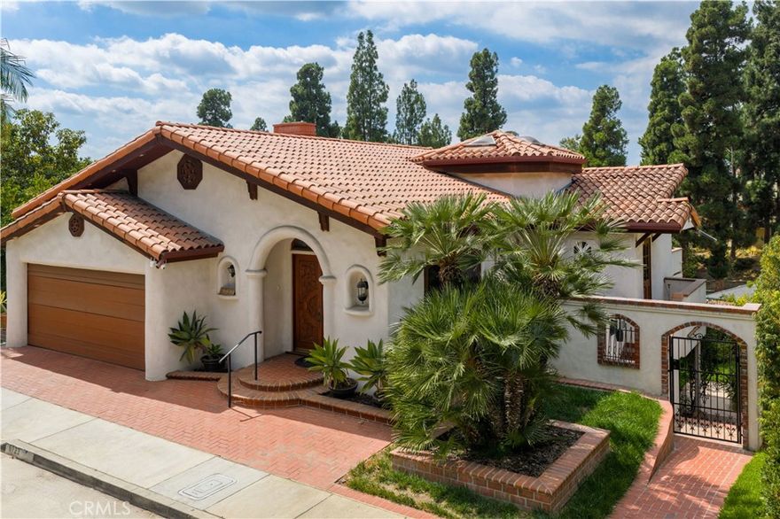A unique mansion overlook the Philadelphia Ave!!! An unbeatable opportunity to own this vintage Spanish style home located in the desirable College Hills neighborhood of Whittier. This lovingly restored home with hardwood floors throughout has 3 bedrooms, 2.5 bathrooms, abundant storage and is approximately 3600 square feet. The location, attention to detail and quality make it one the the most desirable homes in Whittier. The main level offers formal living, dining, great room and an old movie feel kitchen. Step out on the balcony to look down on your 15 fruit tree orchard and tree top views. A home with a soul and grand entertaining spaces designed for large gatherings. EV charger in garage. Words cannot describe this special place. Come to have a look then you will love it. The seller will consider any reasonable offer.