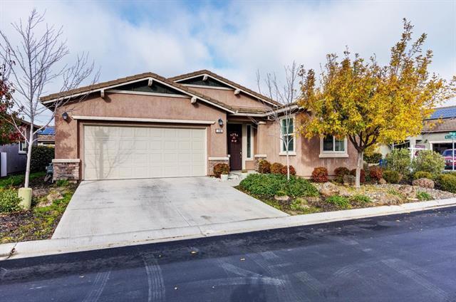 This lovely 2015 corner lot "REFLECT" model provides an open concept. Features 2 bedroom, 2 bath with a den off the foyer. This well designed home maximizes indoor/outdoor living space and offers plenty of natural light. Discover an inviting ambiance with a fusion of warm color tones, soft-beige carpet, hardwood-style tile floors and ceiling fans. A few of the many upgrades you will find in this solar powered home are the Smart Home Technology System and the Pella windows. A well-appointed kitchen has a spacious island; reverse osmosis; granite; stainless steel appliances; cabinetry with pull-out shelves and a breakfast bar. Ample storage throughout the home. Easily accessed from the bright and cheerful dining area, the outdoor living space with a covered patio is perfect for entertaining or simple relaxation. The primary suite includes an en-suite bathroom with split sinks, walk-in closet and a sliding door to the backyard. A second bedroom and bath are ideal for guests. A must see!