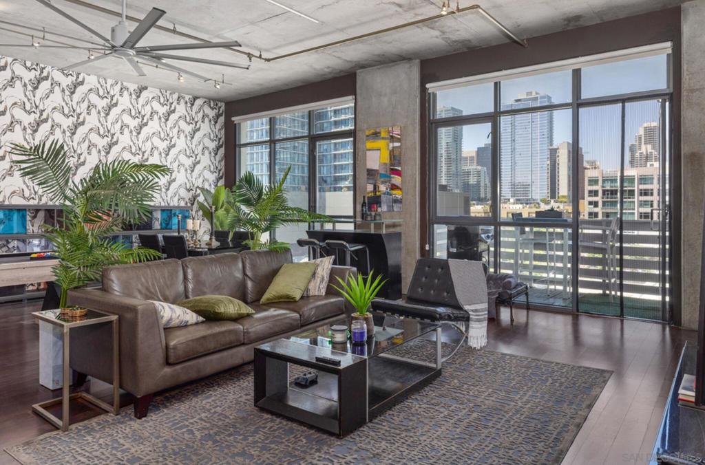 STUNNING LOFT NOW AVAILABLE WITH CAPTIVATING VIEWS! SOARING HIGH CEILINGS OPEN AESTHETICALLY PLEASING SPACE! BALCONY FLOWS OFF LIVINGROOM FEATURES HARDWOOD FLOORING. EXPANSIVE FLOOR TO CEILINGS WINDOWS TO ENJOY DOWNTOWN CITYSCAPE HIGHRISE VIEWS. BALCONY OFF LIVINGROOM-OPEN KITCHEN FLOORPLAN- SPACIOUS MASTERBEDROOM AND MASTERBATH. LOFT FEATURES 2 FULLS BATHROOMS. 2 SIDE/SIDE PARKING COMPLEX FEATURES ZEN LIKE LANDSCAPED COURTYARD-SECURED PARKING FOR TWO VEHICLES, FITNESS CENTER, COMMON AREA ROOFTOP WITH GRILLS FOR YOU OUTDOOR PLEASURE. LIVE IN THE HEART OF DOWNTOWN SD AND ENJOY WALKING TO ALL THE HOTTEST RESTAURANTS AND NEWEST STOREFRONT! TAKE IN A BASEBALL GAME OR THE LATEST CONCERTS AT PETCO PARK JUST COUPLE BLOCKS AWAY. STUNNING LOFT NOW AVAILABLE WITH CAPTIVATING VIEWS! SOARING HIGH CEILINGS OPEN AESTHETICALLY PLEASING SPACE! BALCONY FLOWS OFF LIVINGROOM FEATURES HARDWOOD FLOORING. EXPANSIVE FLOOR TO CEILINGS WINDOWS TO ENJOY DOWNTOWN CITYSCAPE HIGHRISE VIEWS. BALCONY OFF LIVINGROOM-OPEN KITCHEN FLOORPLAN- SPACIOUS MASTERBEDROOM AND MASTERBATH. LOFT FEATURES 2 FULLS BATHROOMS. 2 SIDE/SIDE PARKING SPACE COMPLEX FEATURES ZEN LIKE LANDSCAPED COURTYARD-SECURED PARKING FOR TWO VEHICLES, FITNESS CENTER, COMMON AREA ROOFTOP WITH GRILLS FOR YOU OUTDOOR PLEASURE. LIVE IN THE HEART OF DOWNTOWN SD AND ENJOY WALKING TO ALL THE HOTTEST RESTAURANTS AND NEWEST STOREFRONT! TAKE IN A BASEBALL GAME OR THE LATEST CONCERTS AT PETCO PARK JUST COUPLE BLOCKS AWAY.