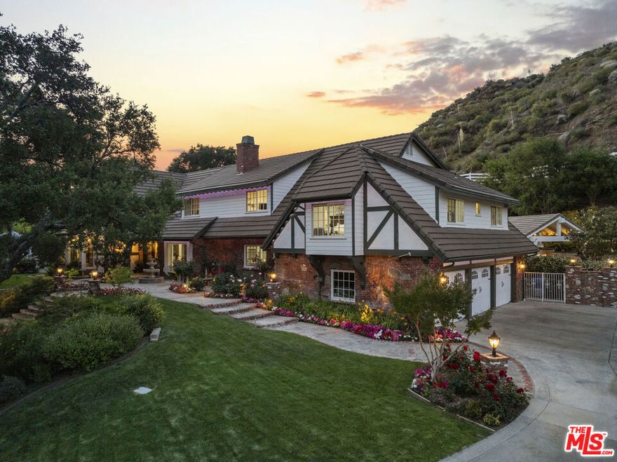 Welcome to 25730 Sand Canyon Rd, a stunning private, custom estate nestled in Santa Clarita's prestigious Sand Canyon. This luxurious 5-bedroom, 4-bathroomresidence offers the rare combination of refined living and total seclusion. Private gated entry leads to sprawling grounds adorned with 7 heritage oak trees, 10planted oak trees, multiple citrus, apple, and peach trees, a boutique vineyard, PLUS a custom climate-controlled wine tasting roomperfect for intimategatherings and entertaining in style. The expansive property includes an RV garage with over 40' of space and full hookups, a 3-car garage, generous guest parkingplus 50 amp service to the RV garage and shop. Inside, the home is full of warmth and character: vaulted wood-beamed ceilings, refinished oak floors, beautifulcustom fireplaces, custom lighting, and plenty of natural light. The formal dining room has a built-in china hutchperfect for dinner parties or holidays. You'll fall inlove with the fully remodeled chef's kitchen, featuring a Sub-Zero refrigerator, Wolf range, farmhouse sink, marble countertops, and a generous center islandallsurrounded by pristine white cabinetry and a cozy breakfast nook. The primary suite is a TRUE retreat, complete with a fireplace, built-in cabinetry, privatebalcony, plus a luxurious ensuite with steam shower, freestanding soaking tub, and dual vanities. Additional highlights include a downstairs bedroom and bath, anexpansive family room that opens to a game room and full bar with dual wine fridges and ice maker. Step outside to your own resort-style backyard, meticulouslydesigned with lush professional landscaping, serene fountains, a fully remodeled pool and oversized spa, an outdoor kitchen with BBQ, a fireplace, gazebo, andpanoramic sunset views. This is more than a homeit's a sanctuary for those who value beauty, privacy, and distinction. Schedule your private showing today andexperience the unparalleled lifestyle that Sand Canyon has to offer! NO HOA or MELLOROOS!