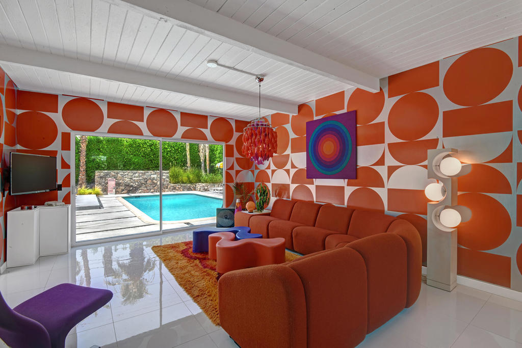 Welcome to ''The Retro Palm Springs'' - Tucked away on a quiet cul-de-sac in the heart of Racquet Club Estates, this one-of-a-kind Mid-Century Modern home has been meticulously reimagined with a bold nod to the design spirit of the late 60s and 70s. Walls of glass open seamlessly to a lush, private backyard oasis featuring a heated pool, detached spa, and plenty of space for relaxation or entertaining--perfect whether you're working from home or enjoying a Palm Springs retreat. Being offered Turnkey furnished, every detail of this 4 bed/3 bath has been thoughtfully curated over years of collecting and blending vintage character with modern convenience. Many wallpapers are rare new-old-stock from the 1970s, maintaining the retro aesthetic. Taken down to the studs, the home now offers today's best updates including a stylish new kitchen, remodeled pool, designer lighting and fixtures, and updated plumbing and electrical throughout. The detached casita is ideal for guests or entertaining, complete with a kitchenette and views of the mountains. The primary suite is a true retreat, opening to a gorgeous private outdoor shower and soaking tub. 2101 Berne has been featured in the publications Shelter and Atomic Ranch - it embodies the quintessential indoor-outdoor Palm Springs lifestyle the desert is known for.. With its electrifying design and undeniable charm, this home is not just a place to live, but a showpiece meant to be experienced.