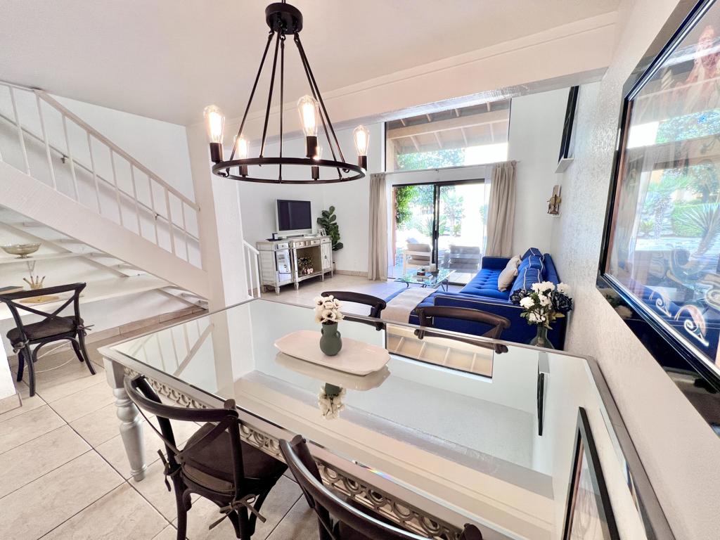 HUGE PRICE REDUCTION!! Bright loft condo, furnished with views out to peaceful waterways and beautifully landscaped common area. Walking distance to Polo/Festival grounds, close to shopping and multiple golf courses. Unique loft layout is very desirable to renters and location is amazing for STRs (with HOA approval and license). Quail Lakes is a quiet gated community with pool, hot tub & tennis courts. Large patio looks out onto green space and is well-shaded with private laundry in closet. Private attached garage included. Kitchen, dining area, desk space, living room and half bath are on lower level. Master bedroom, master bath with 2 closets are upstairs on second level. New laminate flooring upstairs and tile downstairs. Great desert getaway or investment property - simply ''lock it & leave it'' when you're not here. Association-paid water, you pay only electric.