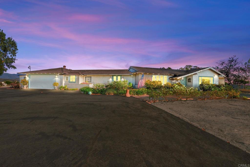 VIEWS! VIEWS! VIEWS! Sprawling Single-Story Retreat in Fallbrook! This 3-bedroom, 2 1/2 -bath home offers 2466 sq. ft. of open living space designed to maximize comfort and views. From the kitchen and living room, enjoy breathtaking mountain vistas, with massive sliding glass doors that flood the home with natural light and seamless indoor-outdoor living. The spacious kitchen features double ovens, a large island, and abundant cabinetry, perfect for entertaining or everyday cooking. Nearly every room showcases stunning views, while the living area flows effortlessly to a covered patio overlooking the pool and rolling hills for miles. A private gated entrance adds exclusivity, with plenty of space to add an ADU or shop. Located in one of Fallbrook’s most desirable neighborhoods, this home offers privacy, luxury, and easy freeway access. Not to mention the property recently appraised for $1,185,000. Don't miss out, this is priced to sell!