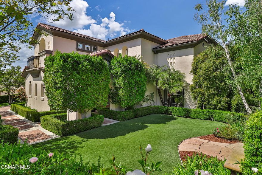 Best value for the money in Westlake Village!Elegant North Pointe Estate with DOUBLE IMPERIAL Staircases, Expansive Entertainer's Backyard & Incredible Privacy!Welcome to 2589 Featherwood Street--a STUNNING estate in the exclusive gated enclave of North Pointe, Westlake Village! Set on a beautifully manicured CORNER lot, this 5-bedroom + Bonus Room, 4.5-bath home offers 4,481 square feet of sophisticated living with TALL ceilings, bold architectural details, and a seamless flow designed for luxury, comfort, and entertainment.From the curb, the home's commanding presence is unmistakable: a striking paver-stone driveway, manicured landscaping, and a handsome stone-surfaced coffee nook create a grand welcome. Step inside through the elegant front door, flanked by sidelights and beneath triple arched windows, into a MAJESTIC foyer adorned by SOARING ceilings and regal DOUBLE IMPERIAL staircases with custom wrought-iron railings--a true showstopper.Formal spaces elevate entertaining, with a GRAND Dining Room showcasing a large arched window, lofty ceilings, and chic chandelier, while the Living Room stuns with a tray ceiling crowned by a custom mural. The Family Room is warm and inviting, boasting a built-in media center, gas fireplace, and a wall of tall plantation-shuttered windows framing views of the entertainer's backyard.At the heart of the home, the GOURMET Kitchen delivers everything a chef dreams of--highlighting an expansive central island, attractive granite countertops, custom cabinetry, sunny breakfast nook, and premium stainless-steel appliances including a GE Monogram 6-burner GAS cooktop and GE DOUBLE oven.The Primary Bedroom Suite enjoys its own private wing upstairs, accessed through double doors and offering sweeping VIEWS of the local hills/mountains from three tall windows, a double tray ceiling, and a DEEP walk-in closet with custom built-ins. The LAVISH Primary Bathroom indulges with stone-tile flooring, dual vanities, a jetted soaking tub, and a large tiled shower.Four additional bedrooms provide versatile living options: a downstairs bedroom with en-suite bath, two upstairs secondary bedrooms (one with an en-suite, one with access to the upstairs hall bath), plus a bright downstairs office with its own walk-in closet and plantation-shuttered windows overlooking the yard. A MASSIVE upstairs Bonus Room adapts beautifully as a media room, gym, or playroom, complete with deep walk-in storage and multiple closets.The entertainer's BACKYARD is a private oasis, framed by tall block walls and designed for unforgettable gatherings. Enjoy a spacious stamped colored-concrete patio under a NEW patio cover, a BUILT-IN BBQ center with stacked-stone surfacing, granite counters, stainless Fire Magic grill, and bar seating. A HALF-BASKETBALL COURT, sprawling artificial turf lawns, elegant hardscaping, concrete pathways, and a rotunda-style backyard lounge add layers of functionality and fun. A dedicated dog run area with artificial grass completes this versatile outdoor haven.Additional highlights include a 2-car garage with built-in metal cabinetry, ceiling storage racks & tool bench, plus a single-car garage currently outfitted as a home gym.At this home you'll enjoy CLOSE proximity to golf courses, parks, fantastic dining & shopping, with quick freeway access (101 & 23) for easy commuting. Zoned for top-tier Conejo Valley Unified schools, and just moments from North Ranch, Westlake Village Town Center, and serene hiking trails--this estate represents the pinnacle of Westlake Village living.Don't miss the chance to make this stunning North Pointe retreat your forever home!