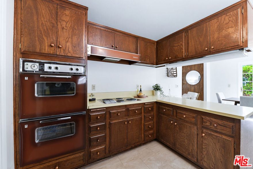 884 Boxthorn Avenue  Newbury Park, CA Retro Soul. Modern Confidence. Fresh on the Market for the First Time Since 1966. Step back in time - but with the comfort of today - at this three-bedroom, two-bathroom, 1,172 sq. ft. mid-century gem. Original owner since day one, this home is making its market debut after nearly six decades of love, life, and just the right dose of vintage charm. Inside, you'll find the real deal: original two-inch wood plank floors (professionally refinished to gleam), freshly painted walls, doors, and baseboards, plus ceilings that have been scraped and smoothed to a crisp, modern finish. And yes, the original ovens and electric cooktop are still here - and still cooking. It's a retro flex that doubles as a conversation starter. A few wood-paneled walls remain, keeping just enough of that 1960s swagger alive. And instead of avocado green, this one serves up the era's other classic palette-warm, earthy brown accents. Think less guacamole, more dark chocolate. The big-ticket items? Already handled. The roof, heating, air conditioning, hot water heater, and newer dual-pane vinyl windows have all been done. Even better, the home comes with a clear termite report and a recent main sewer line inspection, so you can move in with peace of mind. Step outside, and the backyard transforms into a private paradise - nearly two dozen varieties of fruit trees and berries, plus a vibrant display of blooming flowers, all framed by postcard-worthy views of Boney Mountain. It's equal parts orchard, retreat, and entertainer's dream. This is mid-century modern with a twist: refreshed, move-in ready, and waiting for its next owner to write the next chapter. After all, they don't make 'em like this anymore.