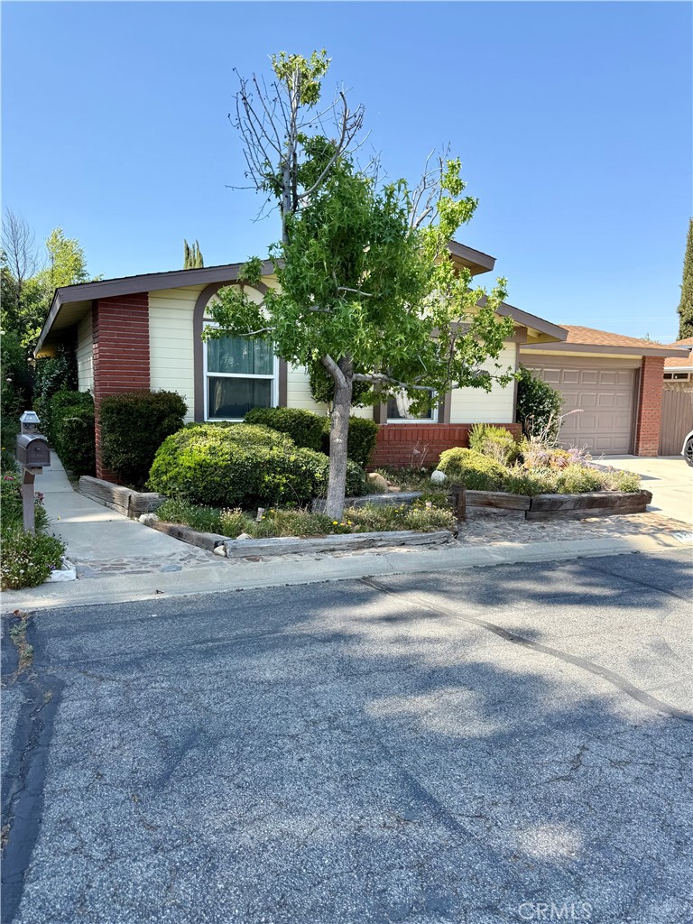 Welcome to your new home in Castaic! This charming detached residence offers 3 bedrooms, 2 bathrooms, and almost 1400 sqft of comfortable living space. Inside, you'll find laminate flooring complemented by newer carpet, spacious kitchen featuring stainless steel appliances, a breakfast bar, and direct access to your two car garage. The bathrooms have also been tastefully remodeled to provide a modern touch. Central air conditioning is newer along with a washer & dryer conveniently located just off the guest bedrooms. You also have a spacious, well-maintained yard, perfect for outdoor gatherings and relaxation. The community boasts low HOA dues and fantastic amenities including a large park and a refreshing pool, ideal for leisure and recreation. Located very close to Castaic Lake, this home offers easy access to shopping centers and is freeway-close for effortless commuting. Don't miss out on this opportunity to embrace the Castaic lifestyle—schedule your showing today!