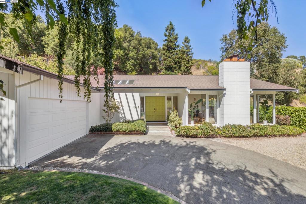 Stylish and private, this lovingly upgraded 3BD/2BA Mid-century home offers easy living on one level in Lafayette’s beautiful Burton Valley. The 1919 SQFT home is tucked away on a quiet cul-de-sac, surrounded by mature trees. Floor-to-ceiling windows stream sunlight onto the home’s gorgeous plank hardwood floors. You can relax in the spacious living area with a fireplace, enjoy your meals with a garden view in the dining room, or cook in the large kitchen while your family and friends gather at the breakfast bar or in the adjoining den. The den’s mullioned sliding glass doors open onto the private backyard for wonderful indoor/outdoor living. With a pretty Mediterranean garden as your backdrop, you can entertain on the large patio, unwind in the hot tub, relax with a book on the deck, or play on the lawn. Back inside, the home’s sleeping wing features three sunny bedrooms, a laundry room, storage, and interior access to the large 2-car garage. Two bedrooms share a full bath, while the primary suite features custom closets and its own full bath. Out your front door, enjoy the best of Burton Valley living near BV Elementary, the Rancho Colorados Swim and Tennis Club, and the Lafayette-Moraga Trail, with easy access to parks and downtown Lafayette’s shops and restaurants.