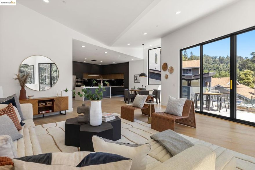 Welcome to 7260 Woodrow Drive, where brand-new construction meets inspired design in the heart of Montclair. This architecturally striking 4-bedroom, 3-bathroom home is a rare blend of modern sophistication and warm, livable comfort. From the moment you enter, you’ll be captivated by the artistic expressions woven throughout the space—from clean, modern lines to thoughtfully curated finishes that elevate every room. The open floor plan is designed for both connection and flow, offering seamless transitions between the living, dining, and kitchen areas—perfect for entertaining or quiet evenings at home. The home’s architectural style embraces volume and light, with expansive windows and soaring ceilings that draw in natural light and surrounding greenery. Every room feels intentional, blending bold modern design with a grounded sense of place. Located just minutes from Montclair Village, hiking trails, parks, and top-rated schools, this one-of-a-kind property brings contemporary elegance to one of Oakland’s most desirable neighborhoods.