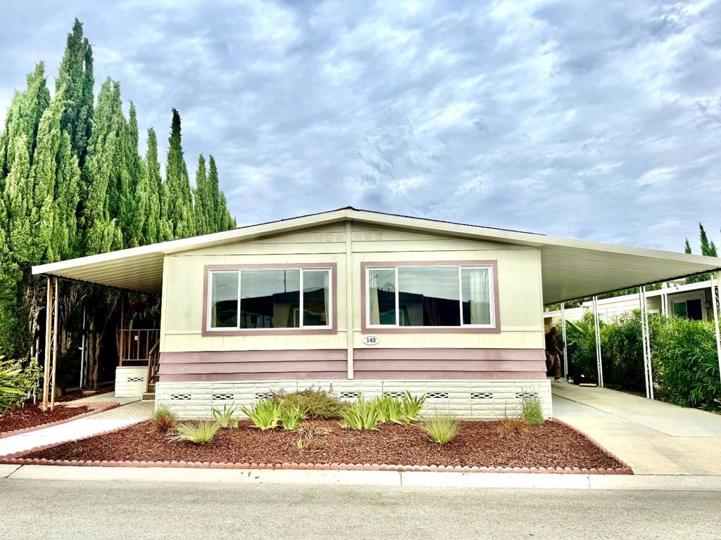 Welcome to this charming 2-bedroom, 2-bathroom manufactured home nestled in the beautiful valley below Communication Hill. Mountain Springs Mobile Home Park is an age restricted 55+ five-star community. Spanning 1,440 sq ft, this residence offers a comfortable and functional living space. The kitchen is well-equipped with a gas cooktop, built-in oven, dishwasher, refrigerator, exhaust fan, and pantry, ensuring all your culinary needs are met. The kitchen seamlessly flows into the family room, creating a warm and inviting atmosphere perfect for gatherings. Enjoy the convenience of a dining area adjacent to the living room, complemented by cozy carpeting throughout. Central AC and ceiling fans provide optimal comfort year-round. The property also boasts a separate laundry room with a washer and dryer for added convenience. Additional amenities include double-pane windows, drapes & custom blinds. There are two large exterior storage sheds, a spacious front deck and patio area, and generous carport parking. Shopping is nearby (Home Depot, Lucky's, CVS, & Starbucks) and there is easy freeway access to downtown San Jose & the airport just a few miles away. Don't miss this gem just waiting for you to call it home. This home has low space rent of $997/month with no property taxes.