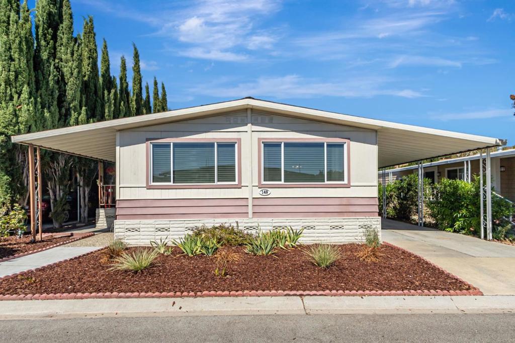 Welcome to this charming 2-bedroom, 2-bathroom manufactured home nestled in the beautiful valley below Communication Hill. Mountain Springs Mobile Home Park is an age restricted 55+ five-star community. Spanning 1,440 sq ft, this residence offers a comfortable and functional living space. The kitchen is well-equipped with a gas cooktop, built-in oven, dishwasher, refrigerator, exhaust fan, and pantry, ensuring all your culinary needs are met. The kitchen seamlessly flows into the family room, creating a warm and inviting atmosphere perfect for gatherings. Enjoy the convenience of a dining area adjacent to the living room, complemented by cozy carpeting throughout. Central AC and ceiling fans provide optimal comfort year-round. The property also boasts a separate laundry room with a washer and dryer for added convenience. Additional amenities include double-pane windows, drapes & custom blinds. There are two large exterior storage sheds, a spacious front deck and patio area, and generous carport parking. Shopping is nearby (Home Depot, Lucky's, CVS, & Starbucks) and there is easy freeway access to downtown San Jose & the airport just a few miles away. Don't miss this gem just waiting for you to call it home. This home has low space rent of $997/month with no property taxes.