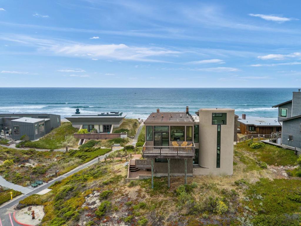 Whether you're seeking a peaceful beach retreat, a gathering place for generations, or an income-producing coastal getaway, this one-of-a-kind property is ready to welcome its next chapter. Offered for the first time, 64 Avocet is located in one of the most desirable locations in Pajaro Dunes with some of the most breathtaking panoramic views in the community. The views are endless, stretching from the Pacific Ocean to the Pajaro River, surrounding valley, and iconic Moss Landing. Thoughtfully designed for both relaxation and entertaining, this large home features 4 bedrooms plus a unique crows nest lookoutperfect for enjoying sunrise coffee or sunset wine with endless vistas. The expansive bonus level downstairs has its own separate entrance, bathroom and patio, offering flexible space for guests, a media room, or a home office. Just steps from the sand and close to convenient parking, this home blends the serenity and accessibility for coastal living. Ideally located between Santa Cruz and Monterey/Carmel, it is a perfect weekend escape that offers excellent potential as a short-term rental investment. Don't miss your chance to claim your very own slice of California paradise.