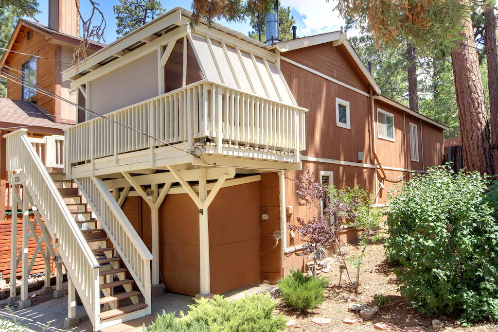 Charming Big Bear cabin near it all! Located just minutes from the National Forest, Big Bear Lake, Bear Mountain, Snow Summit, restaurants, and the Village, this 2-bedroom, 1-bath home offers both comfort and convenience at an affordable price. Whether you're seeking a full-time residence, a weekend getaway, or a short-term rental investment, this property checks those boxes. Enjoy level, off-street parking and a versatile bonus area beneath the main living space--complete with laundry hookups--ideal for an office, hobby room, or extra storage. There's also an enclosed storage area under the front deck for added convenience. The primary bedroom features a window A/C unit and a sliding glass door that opens to the fenced back yard with a deck and relaxing hot tub--perfect for unwinding after a day on the slopes or lake. All existing appliances and the hot tub are available to be included with your offer, making this a truly move-in-ready opportunity in Sugarloaf.
