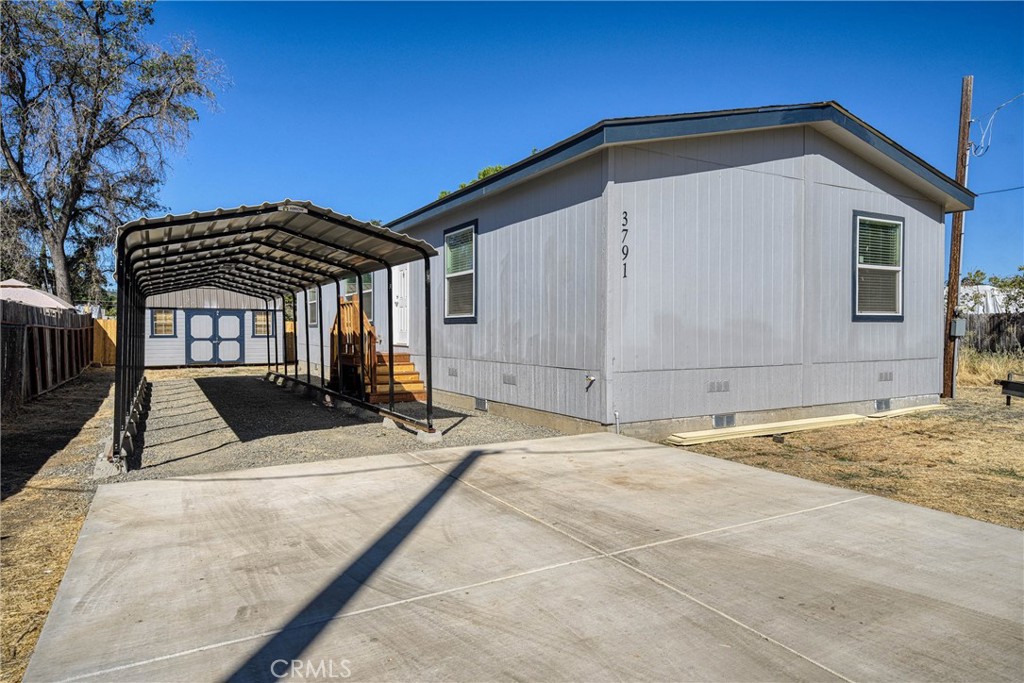 Welcome to 3791 Robinson Ave, a brand new manufactured home offering modern comfort and quality construction in the heart of Clearlake. This thoughtfully designed 3-bedroom, 2-bathroom home features 1,440 square feet of well-planned living space with an open concept layout that creates a seamless flow between rooms.
The home showcases quality building standards with a sturdy 433A foundation that makes financing straightforward and reliable. Inside, you'll find durable vinyl plank flooring throughout and spacious rooms designed for comfortable living. Both bedrooms include convenient walk-in closets for ample storage, while the kitchen comes equipped with new appliances ready for your first meal.
Outside, a large carport provides covered parking and weather protection, complemented by a useful storage shed for all your outdoor equipment and seasonal items.
The neighborhood offers excellent convenience with Super Chavez Market located nearby for your daily shopping needs. Austin Park sits nearby, providing green space for recreation and relaxation. Residents will appreciate the proximity to the Clearlake Education Centers, ensuring quality educational options are within reach.
This property combines the benefits of new construction with the established charm of the Clearlake community. The home's practical layout, quality features, and convenient location make it an ideal choice for those seeking modern living in a welcoming neighborhood. With everything move-in ready, this represents an excellent opportunity to own a quality home in a desirable area.