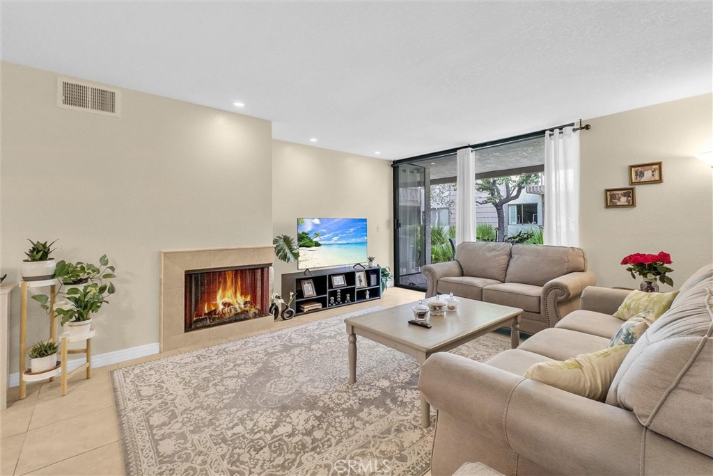 Single-level condo located in the Quail Creek Community featuring 2 bed/2 bath. Enjoy an open floor plan filled with abundant natural light, generous storage space, and a seamless flow into the versatile family room, onto the large patio to enjoy views of serene running creeks and ponds, where the gentle sounds of nearby waterfalls create a peaceful retreat. The home design offers Two private suites, with plenty of common space for a growing family. This home includes two assigned parking spaces—one covered and one open—conveniently located to your home. The well-maintained community provides outstanding amenities including two sparkling pools, two relaxing hot tubs, a rejuvenating sauna, two light tennis courts, and an EV charging station, making it perfect for anyone’s lifestyle. Conveniently located just miles from the beach and near the I-5 and 73 Toll Road, close to top-rated schools and local shopping. It offers the perfect blend of comfort, style, and convenience.