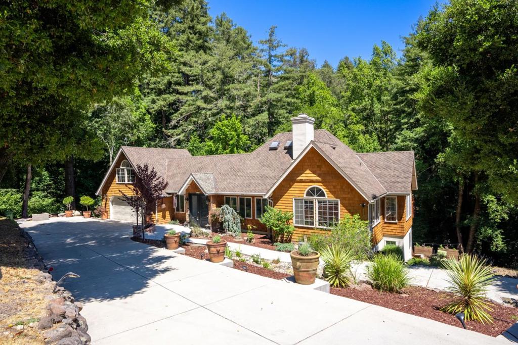 Updated Home in Desirable Neighborhood. This beautifully updated home is ideally situated between Santa Cruz and Scotts Valley, just off Glen Canyon Road, in a highly sought after area. Its unique charm and abundant natural light create an inviting atmosphere throughout. The residence offers three spacious bedrooms and a living room with soaring ceilings and a cozy woodburning fireplace. The kitchen opens to a patio, providing an excellent space for entertaining family and friends. Designed to be kid friendly, the yard features low maintenance synthetic grass. A custom built shed adds extra storage, complementing the ample space available above the garage. The property includes a whole house generator, water filtration system, air conditioning unit upstairs, and a large two car garage. Storage is abundant, with easy access to additional space from the fourth bedroom above the garage. Recent improvements include new landscaping, a water tank, new blinds and flooring, and a remodeled downstairs bathroom, enhancing both comfort and style. With easy access to Hwy 17, Santa Cruz, and Scotts Valley, this home is perfectly positioned to minimize traffic, no matter which direction you are headed.