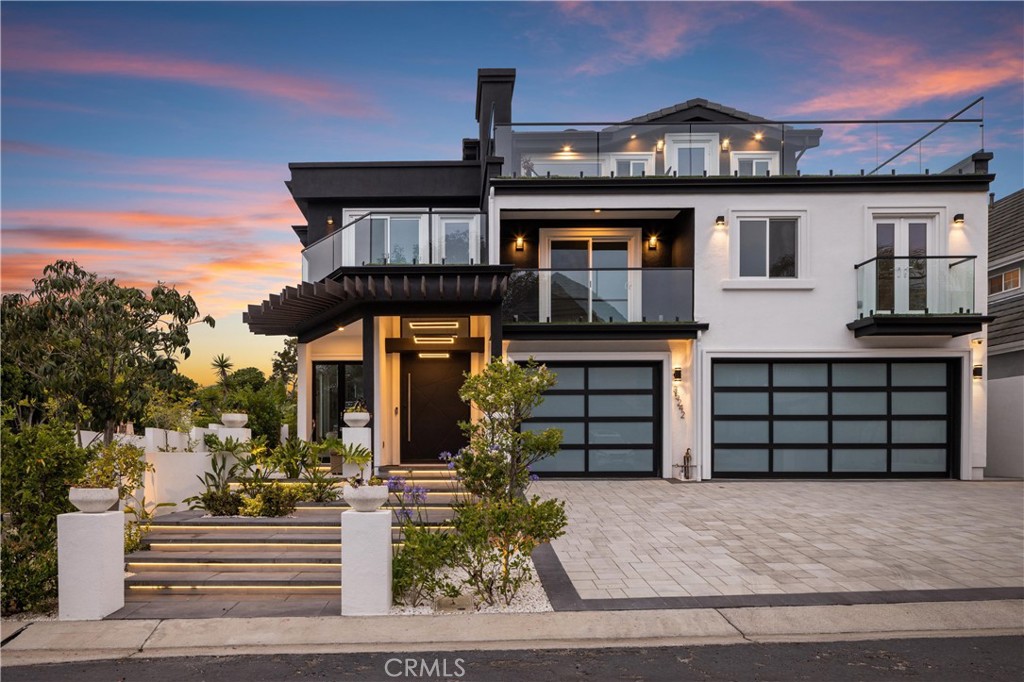 Ocean view, Coastal Luxury living at its best, fully rebuilt 6,409 Sq Ft of living space, in Capistrano Beach Community, Dana Point. Experience this gorgeous, custom Estate, blending timeless California architectural charm with contemporary design, enter through a dramatic 5-ft wide by 8-ft metal pivot door into a breathtaking living room featuring 12-foot ceilings, designer lighting, a modern fireplace, double-glazed windows offering serene views of the landscaped side garden and patio. Enjoy entertaining in the marble top wet-bar beautiful glass cabinets, built-in wine cooler, adjacent to the formal dining room, expansive gourmet kitchen, equipped with Thermador appliances, wine cooler, marble flooring spacious, cabinets, double sinks, stone countertops breakfast area, kitchen overlooks the putting green, outdoor BBQ complete with a built-in wine cooler & Italian pizza oven. Additional highlights include Custom teak wood flooring, state of the art glass staircase, w/ black steel, handrails 6 en-suite bedrooms, & 2 guest bathrooms, in total 8 bathrooms, private upstairs office with its own balcony ocean views. In addition, you have 1,000 sq ft of attic storage space, 3-car garage 400-amp panel, EV charging capability. Fully landscaped grounds with stone driveway, fruit trees, this is truly a one-of-a-kind property just minutes from the beach, - where craftsmanship, luxury, and location come together in perfect harmony.