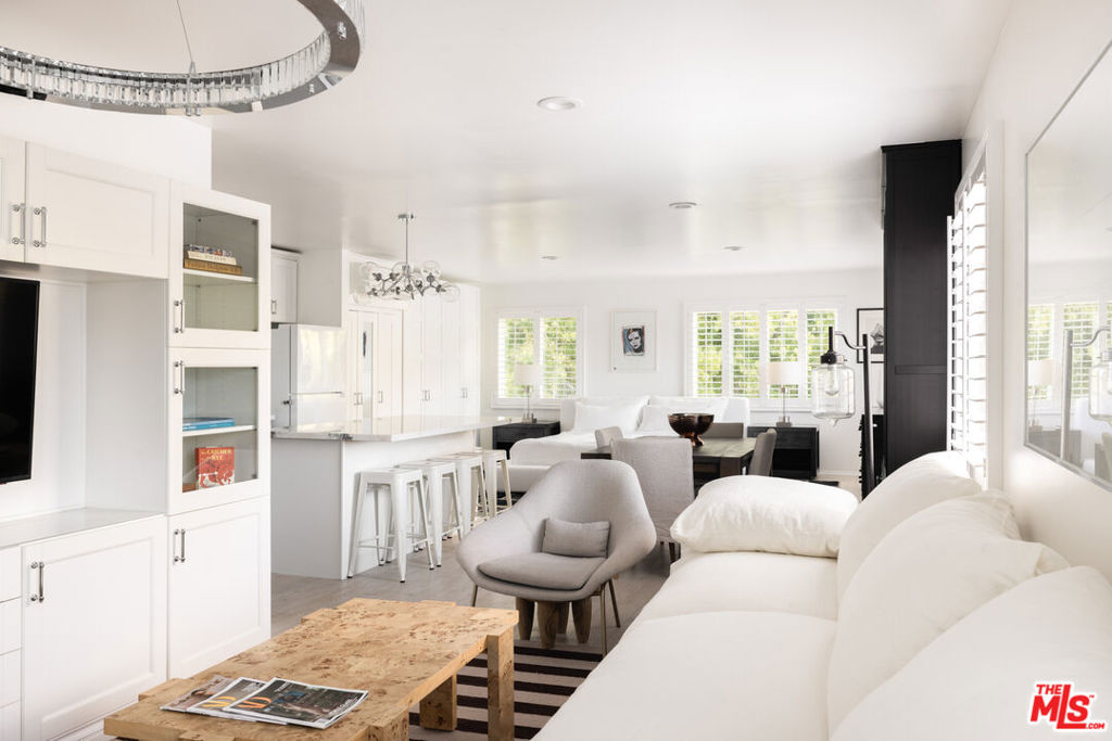 Perched above a quiet cul-de-sac in Beverly Hills, this fully outfitted guest house offers a private, turnkey lease opportunity with its own dedicated entrance and address. Available furnished or unfurnished, the space is ideal for those seeking comfort, style, and flexibility in a serene setting. Inside, the guest house features a full kitchen with veined granite countertops, ample cabinetry, and modern appliances, flowing into an open-concept living area with built-in storage and natural light. The spacious bathroom is finished in elegant marble and includes a gorgeous shower, while in-unit laundry and thoughtful built-ins enhance everyday convenience. Outdoors, enjoy your own wraparound deck with a built-in grill and hillside views perfect for al fresco dining or relaxing in privacy. With no shared interior walls and complete separation from the main residence, this unique space lives like a single-family home. The main house is not included in this lease offering and is being offered for lease separately.