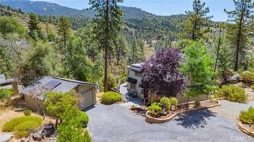 Escape to the Mountains: Dome Style Retreat with Sweeping Views
Tucked away just 5 minutes from Idyllwild’s charming village, this one-of-a-kind dome-style home offers breathtaking views of the surrounding mountains and valley, including Mt. San Jacinto. Designed to maximize space and natural light, the open-concept two-story layout lives larger than its square footage suggests, featuring oak hardwood floors, plush carpeting, and a beautiful rod iron staircase that adds character and warmth.
Step outside to enjoy the serene wrap-around porch, private gazebo with fire pit, and paid-off solar system making it the perfect blend of comfort and sustainability. Downstairs includes a bonus room ideal for a studio, office, or guest space (not included in SQFT). Whether you're looking for a peaceful full-time residence or a tranquil secondary home, this property radiates cozy mountain charm.