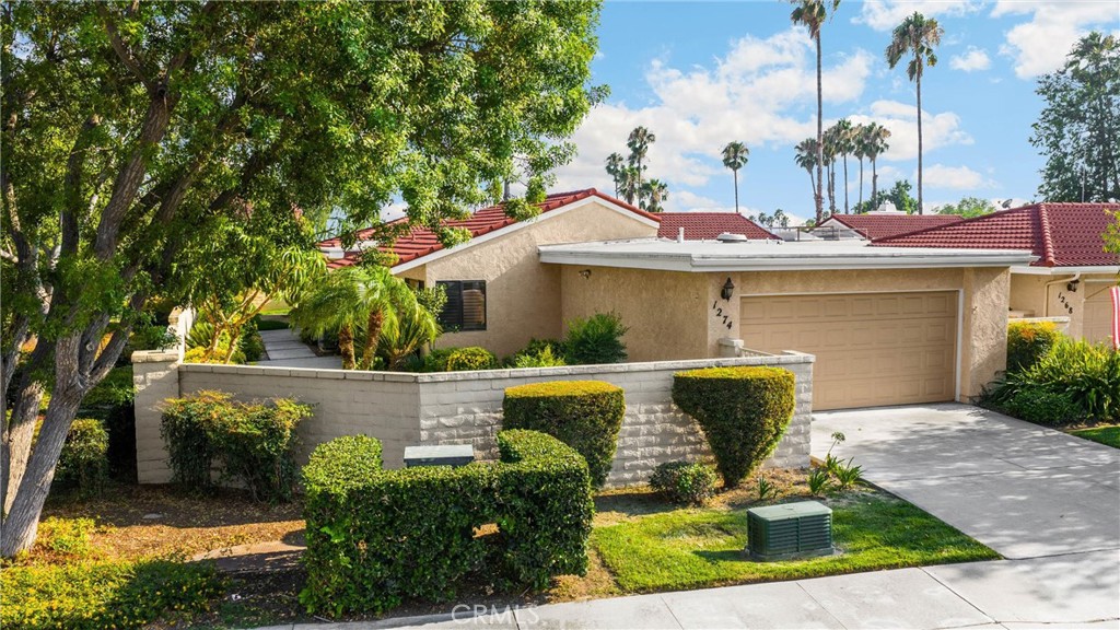 Welcome to this beautifully upgraded single-story condo offering 3 bedrooms, 2 bathrooms and a resort-inspired lifestyle in the prestigious Upland Hills Country Club. Perfectly positioned along the 18th Fairway, this residence showcases breathtaking mountain views and the tranquil sight of a shimmering pond with a fountain. Entertain meals in the dining room with a pretty chandelier and mirrored wall. Step inside to a spacious family room with vaulted ceiling, custom in-cased fireplace with an entertainment area, a stylish wood accent wall, and a ceiling fan with light fixture. A large sliding glass door with shutters fills the room with natural light and opens to the back patio - perfect for enjoying your morning drink of choice or evening sunsets over the golf course. The remodeled kitchen features granite countertops, a decorative tile backsplash, dark refaced cabinets and pantry, recessed lighting, and an eat-in dining area with shutters and a ceiling fan. A convenient back door leads to the patio, creating seamless indoor - outdoor living. The primary bedroom offers neutral carpet, a vaulted ceiling, plantation shutters, a ceiling fan with light fixture, and a walk-in custom closet with mirrored sliding doors. The spa-like ensuite bathroom is designed for relaxation, with granite countertops, brushed nickel hardware, dark cabinetry, decorative mirrors, and a beautifully tiled shower and separate tub area. Secondary bedrooms feature neutral carpeting, while the main living areas are finished with durable, wood-like tile flooring. An interior laundry room with cabinets, recessed lighting, and direct access to a two-car garage - with possible space for a golf cart - adds convenience to your daily routine. The gated landscaped yard is a private oasis with grassy lawn, a variety of trees, vibrant flowering plants, and decorative bushes. The rear patio offers views of the golf course, mountains, and pond with fountain, providing the ultimate backdrop for entertaining or unwinding. Resort-Style Amenities (HOA Includes): Gated Entry, Golf Course Access, Multiple Pools and Spas, Sitting Areas, Front Yard & Common Area Maintenance and more. This home delivers both peaceful and everyday convenience. House and Lot Sq. Ft. per Title. All Information including House and Lot Sq. Ft. to be verified by Buyer(s) and Buyer's Agent.