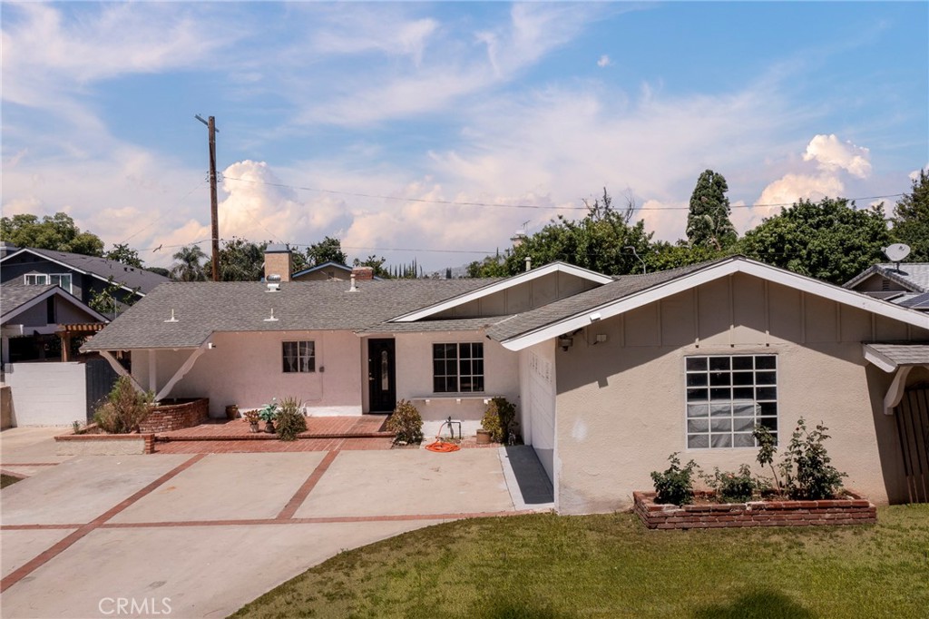Welcome to this beautifully updated 4-bedroom, 2-bathroom home offering comfort, style, and functionality. Step inside to find an inviting layout with laminate flooring flowing throughout most of the home, creating a warm and cohesive feel. The nicely remodeled kitchen features modern finishes, ample cabinet space, and a layout that makes cooking and entertaining a breeze. Both bathrooms have also been tastefully updated with contemporary touches that enhance both form and function. The fourth bedroom is great for guests, or a home office. Outside, enjoy a great backyard perfect for entertaining, gardening, or relaxing in the sunshine. Whether you're hosting a weekend BBQ or letting the kids play, this outdoor space is ready for your personal touch. Ideally located near schools, parks, and shopping, this move-in-ready home checks all the boxes. Don’t miss your chance to make it yours!