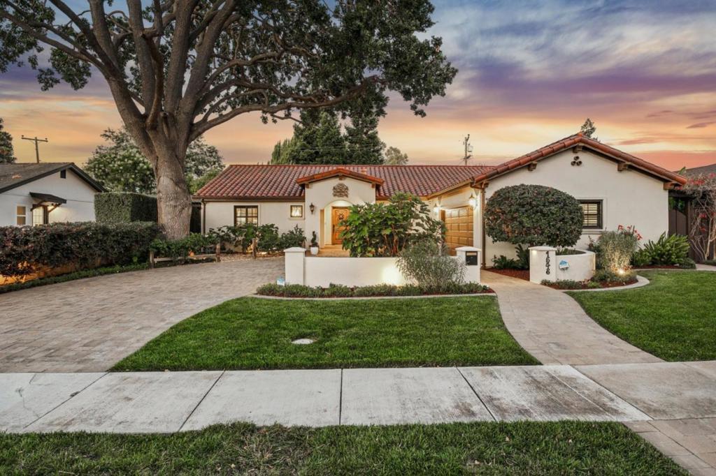 Exquisite, fully remodeled Mediterranean masterpiece in the heart of Willow Glen, 3 bedrooms 2.5 Bathrooms, plus a den/office with custom desk 2,230 sq.ft., 400 sq.ft. 2-car garage with custom e-poxy finish, 7,952 sq.ft. lot, just moments from vibrant Downtowns boutiques, cafés, and festive community events. Taken down to the studs in 2013, this single-story sanctuary showcases unmatched craftsmanship and high-end finishes. A formal entry with custom curved wall and decorative tile flooring sets the tone for refined living. The great room features wood look porcelain tile floors, built-in speakers, and a Heat & Glo fireplace with a custom wood mantel and designer tile surround. The gourmet kitchen is a chefs dream with Wolf 6-burner range, Vent-A-Hood, quartz island, Liebherr refrigerator, Bosch dishwasher, and wet bar. Luxurious primary suite opens to a private patio and boasts a spa-like bath with deep jetted tub, walk-in shower, and dual vanity. Outdoor living shines with paver patios, custom bar with granite counters, BBQ, lush lawn, water fountain, and trellis. Tesla charger, solar on roof, outdoor cameras, Ring doorbell, tankless water heater and more complete this rare offering of elegance and comfort. Stroll to downtown Willow Glen's Lincoln Avenue's shops & restaurants!
