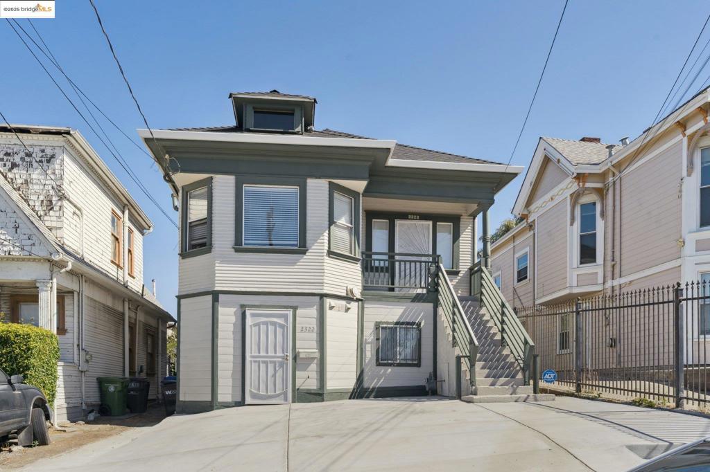 Welcome to a spacious and versatile property offering two separate living levels with classic character and modern potential. The upper level features a light-filled living room, elegant dining room, and a generous kitchen that flows into three comfortable bedrooms, including a primary suite with its own bath. Downstairs, you’ll find an additional living room, oversized bonus spaces, and a laundry area that provides a flexible floor plan that creates endless lifestyle possibilities. Beautiful period details, tall ceilings, and large windows bring warmth and charm throughout. Home has been updated in 2023 with newly installed kitchen, roof, front paved driveway, rear deck, and more. Conveniently located near, transit, and vibrant dining/shopping corridors, this home is ideal for those seeking both space and location in the heart of Oakland.