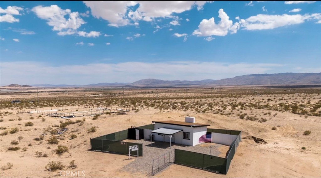 Escape the hustle and embrace the tranquility of off-grid living in this beautifully desert cabin nestled on 5 sprawling acres with breathtaking panoramic views only minutes from Joshua Tree National Park! Whether you're looking for a peaceful getaway or a smart investment, this property offers great potential. Many nearby cabins serve as vacation rentals and Air bnbs. Conveniently located just 15 minutes from local shops and restaurants, yet far enough to enjoy the serenity of the desert. Don't miss your chance to own a piece of the desert. Schedule your showing today and start living your off-grid dream!