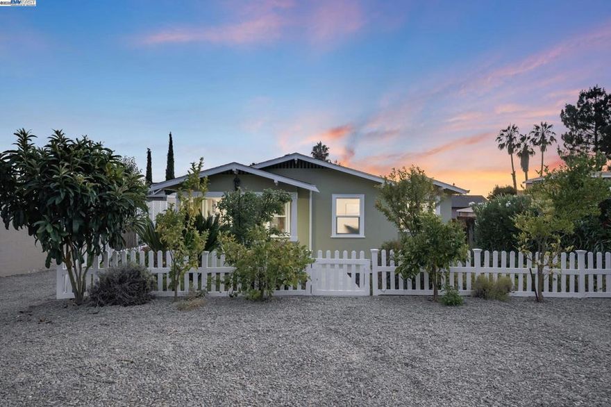 Incredible opportunity in Mission San Jose! Just steps from Mission Elementary and top-rated schools, this charming 3BR/2BA home sits on a 7,500 sq ft R2-zoned lot—allowing for duplex development or the addition of an ADU (buyer to verify). R2 zoning offers rare flexibility in one of Fremont’s most desirable neighborhoods—ideal for investors, builders, or multigenerational living.  Built in 1923, this 101-year-old historic gem features an updated kitchen, recessed lighting, and an EV charger. A fully enclosed barn offers a 2-car tandem garage and a 400 sq ft bonus room, perfect for a studio, office, or future rental unit.  Enjoy a lush backyard retreat with a vineyard-draped pergola and a variety of mature fruit trees—including persimmon, apple, peach, avocado, pomegranate, lime, and orange.  Endless potential awaits in this unique property offering historic charm, modern amenities, and valuable R2 zoning for flexible future use.