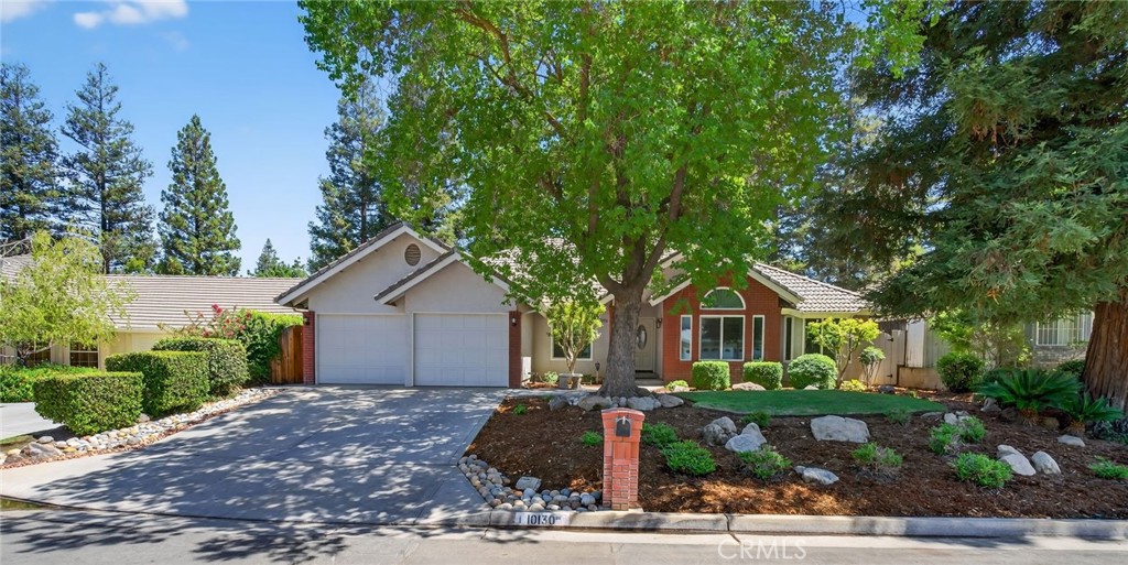 Located in a quiet cul-de-sac in the prestigious Fort Washington area, this beautifully updated home is just one block from Fort Washington Country Club. The HOA community offers 24/7 security patrol, maintained landscaping, and neighborhood standards for only $560 annually. The home features a tile roof, brick façade, durable exterior coating, and professional landscaping. Major upgrades include a full-house repipe, whole-house water filter and softener, dual Rinnai tankless water heaters, triple-pane windows (except under the covered patio), an insulated attic, and a wraparound covered patio ideal for entertaining. A monitored ADS security system is also included. Inside, each room offers thoughtful custom design. Highlights include a living room with beam ceilings, skylight, and designer lighting; a remodeled kitchen with granite counters, lighted cabinets, and KitchenAid appliances; and a dining area with unique ceiling detail. The primary suite features open beam ceilings and a remodeled bath with granite and skylight. Additional bedrooms offer custom lighting, ceilings, and architectural accents. This is a rare opportunity in one of Fresno’s most desirable neighborhoods.