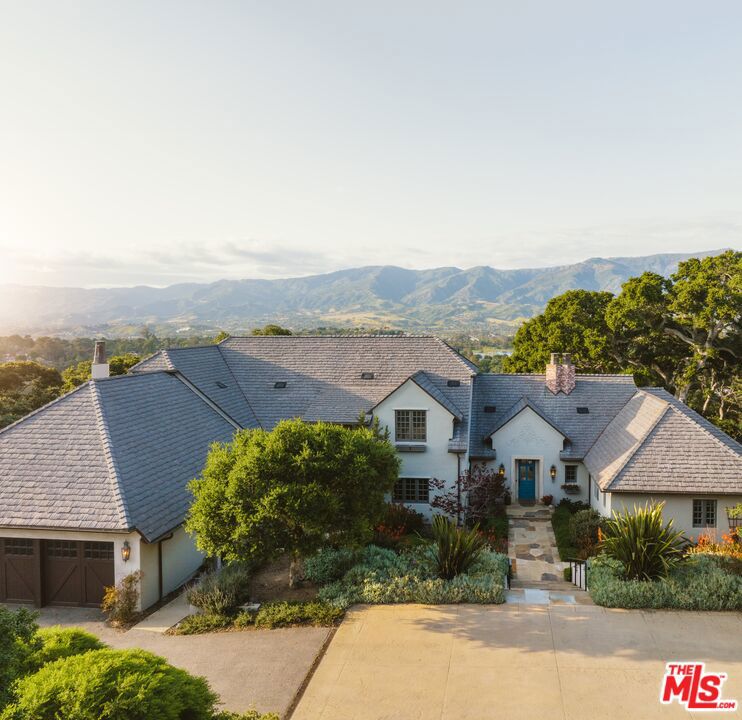 Prepare to be transported to the French countryside as you advance down a long tree-lined drive to the gates of ''Oak Hill.'' Designed to complement the natural undulations of the land & maximize the premier views of the 2.9-acre property, this expansive & well-built home features 4bd, 4.5ba, 2 offices, elegant details throughout such as wide plank reclaimed wood floors, high ceilings, beautiful doors & windows, custom light fixtures, large veranda, & captivating mountain views from nearly every part of the property. The bright & spacious first floor primary suite enjoys dual walk-in closets, radiant heated bathroom floors, copper bathtub, & steam shower. An additional private guest house, wine cellar, pool, & a converted barn w/ 2 flex rooms & additional 2-car garage complete the property. Located in one of California's most enchanting enclaves, Hope Ranch, known for its 32 miles of pastoral equestrian trails, tennis, & private sandy beach, which are also moments away from Santa Barbara's restaurants, shops & gourmet grocery stores.