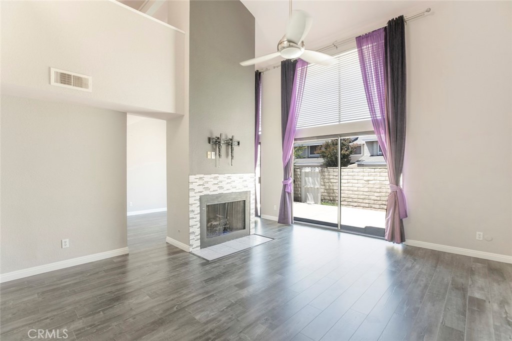 Welcome to this beautifully spacious and updated townhome in the gated Vista Valencia community. This 2 bedroom, 2.5 bath home features an open and inviting layout with vaulted ceilings, a cozy fireplace in the living room, a versatile loft, and a den/office that can be used as a third bedroom or flex space. the upgraded kitchen offers quartz countertops, white cabinets and stainless steel appliances, opening to a dining room perfect for gatherings. The oversized primary suite includes a large upgraded bath and generous closet space. This home has a private patio ideal for entertaining. Enjoy resort-style amenities with a pool, spa and clubhouse and beautifully landscaped grounds. Conveniently located near schools, shopping, dining, bike paths and freeway access.