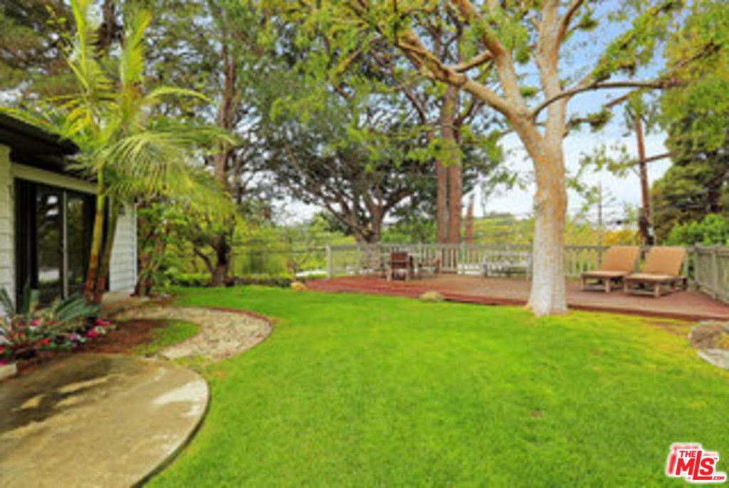 IMMEDIATE MOVE IN AVAILABLE: Carpenter School District! Stunning architectural remodeled corner lot home w/ canyon views situated on a private and very quiet street. Over 2,300 sq ft of lavish tranquility setting on a 12,000 sq ft secluded hilltop. Spectacular, spacious and bright master suite w/ luxurious bath and incredible walk-in closet. Gorgeous and spacious living room and romantic formal dining room. Gourmet Chef's kitchen w/ new appliances and adjoining breakfast nook. Comfy den/family room w/ skylight and addt'l bonus office. French doors open out to a lush garden and yard with an extensive sundeck. Bright and cheery home w/ excellent flow for entertaining featuring hardwood floors, built in speakers and recessed lighting throughout. Brand new central AC/Heating system. Great location! Equal distance to Sunset and Ventura Blvd and close to hiking trails at Briar Summit Open Space Preserve, Fryman and Runyon canyons. A dream retreat every time you come home. Must see!