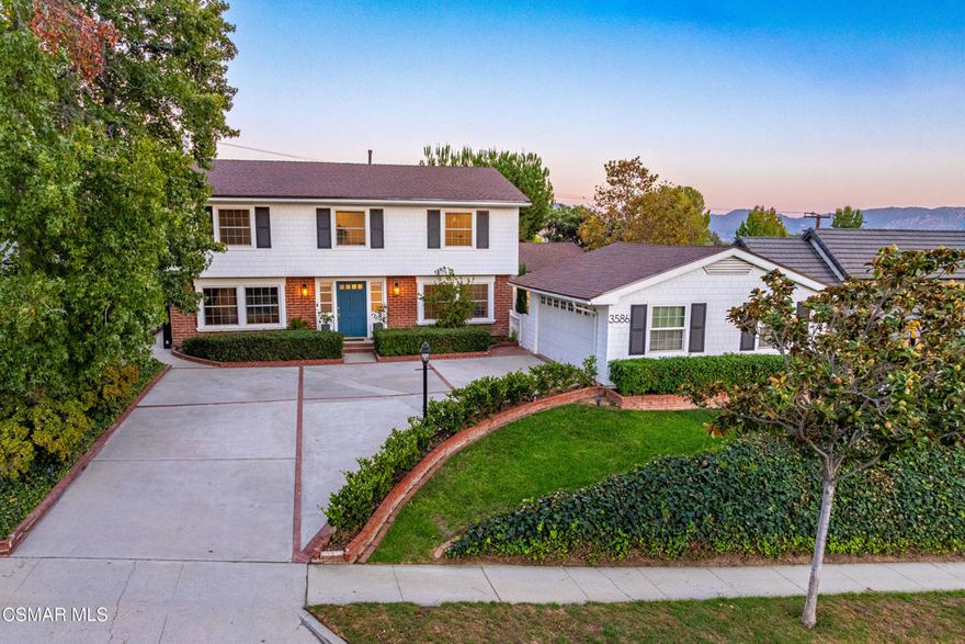 This timeless Colonial-style home is the one you've been waiting for! A true luxury home with modern touches.Nestled near the hills in Simi Valley's highly desirable Nob Hill neighborhood, it offers classic curb appeal with beautiful landscaping, mature trees, and brick accents with black window shutters. A staple of colonial design. Inside, tons of windows bring in a lot of natural light, complemented by recessed lighting and smooth-finished walls and ceilings. Step into the formal entry which leads to either the family room, or the office/den with double glass doors. If needed, that room could be used as a fifth bedroom.The kitchen is the centerpiece of this home. A true chef's kiss. Features in the kitchen include stainless steel Thermador smart appliances, an oversized island ideal for meal prep or entertaining, quartz countertops, porcelain tile backsplash, gold-accent hardware, and an abundant of soft-closing cabinets and drawers. Upstairs, all four bedrooms have been updated with wood-like flooring, recessed lighting, and upgraded sliding closet doors.  The primary suite boasts a beautifully remodeled bathroom with dual shower heads and elegant stone finishes, and a walk-in closet area. The upstairs hall bathroom is just as nice with a remodeled shower and tub, updated vanity, and stone tile floors. Outdoors, enjoy evenings around the firepit, a large grassy area, and fruit trees including pomegranate and grape vines. Additional highlights include dual-pane windows, a whole-house fan, bidets on every toilet, a tankless water heater, a water filtration system, EV-capable charging in the garage, an approximately two-year-old ac unit, and NO HOA! Come see what luxury looks like!