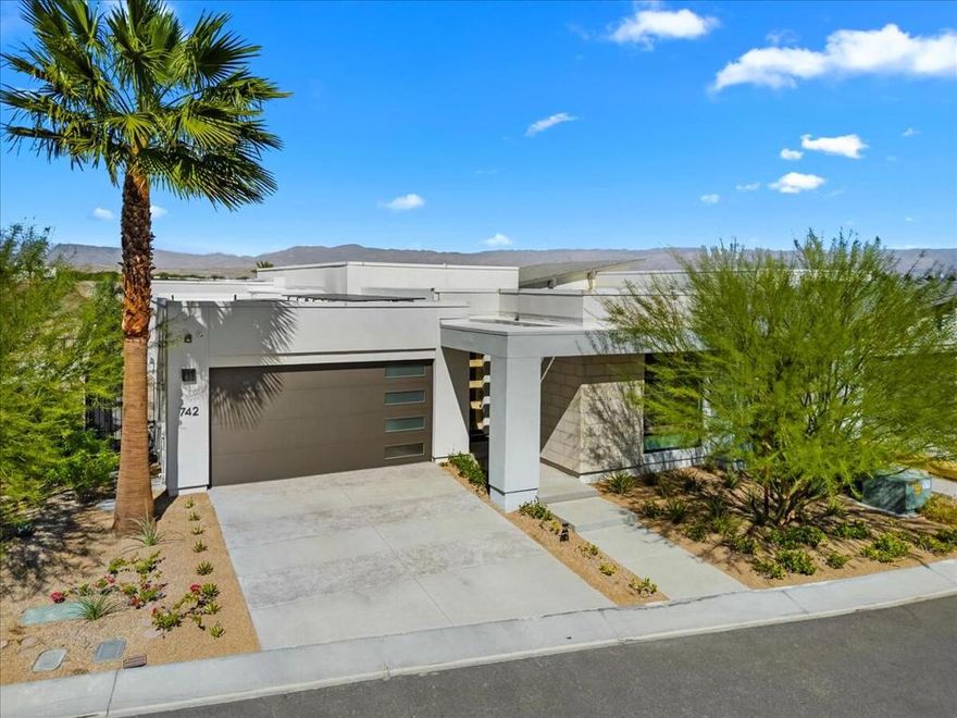 Welcome to Miralon -- and to the ultimate Palm Springs dream home! This highly sought-after design perfectly captures the essence of desert living, featuring nearly $200,000 in builder upgrades. The grand open-concept layout with soaring 13-foot ceilings and expansive sliding glass walls creates the true indoor-outdoor experience Palm Springs is known for. Enjoy breathtaking views of the olive grove, shimmering lake, and 180 vistas of windmills and mountains. Thoughtfully designed for comfort and privacy, this home offers two en-suite bedrooms at the front and a luxurious primary suite with private pool access on the opposite side. --- Miralon offers olive groves, a state-of-the-art clubhouse with two pools, a spa, a fitness center, a yoga studio, a Wi-Fi cafe, a full-service bar, dog parks, a u-pick garden, a bocce ball court, a demo kitchen, a conference room, five lakes, and seven miles of walking trails.