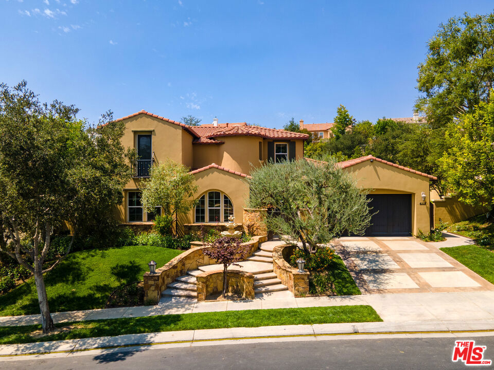 Located in the coveted community of The Oaks of Calabasas, this fully furnished home is highly upgraded with an open kitchen with Viking appliances, including a 48" stove and dual oven, granite countertops, and bar island. The well-adorned kitchen flows smoothly to the family room, formal dining room, and to an outside entertainment area including a two-sided fireplace and complete, sheltered, outdoor kitchen. A desirable first-floor primary bedroom suite opens to the large back yard with a sparkling pool and spa, and a fire pit, sitting area. The Oaks includes 24/7 manned security, a large common pool area, gym, tennis courts, is located in the highly sought after Las Virgenes Unified School District, and is a stones-throw from The Commons shopping center with wonderful shops and restaurants, and a short drive to the famous Malibu Beach. Available for Short Term Lease