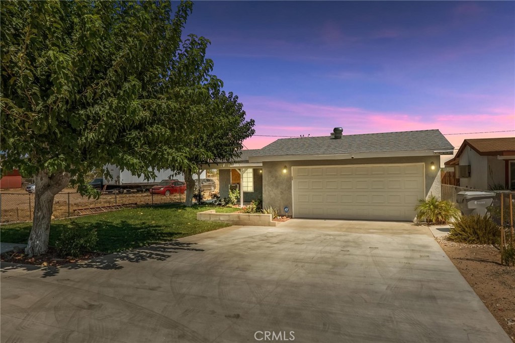 Great starter home, in the still affordable city of Hesperia! This 2 bedroom, 1 bath home offers a large lot of 7,100 Sq. Ft. In this property you can enjoy a green front lawn equipped with an automatic sprinkler system, and a driveway that has been recently replaced, providing improved curb appeal and functionality. The property has received other important upgrades, including newer windows and a roof that was replaced approximately 6 years ago. A flood prevention drainage system has been installed at the front of the home for peace of mind during rainy season. Also, a security system installed in the house with 5 cameras is available. The property is fully fenced, featuring a combination of front chain-link with barbed wire for added security and a newer wood fence enclosing the backyard for privacy. There is also access from the alley, located in the back of the property to park your extra cars, recreational vehicles or toys. With a price point well below the area’s median values, this home presents a competitive opportunity for first-time buyers, downsizers, or investors. Conveniently located near schools, shopping centers, and commuter routes. There are not that many houses for this price range in the area, show it or book an appointment today!